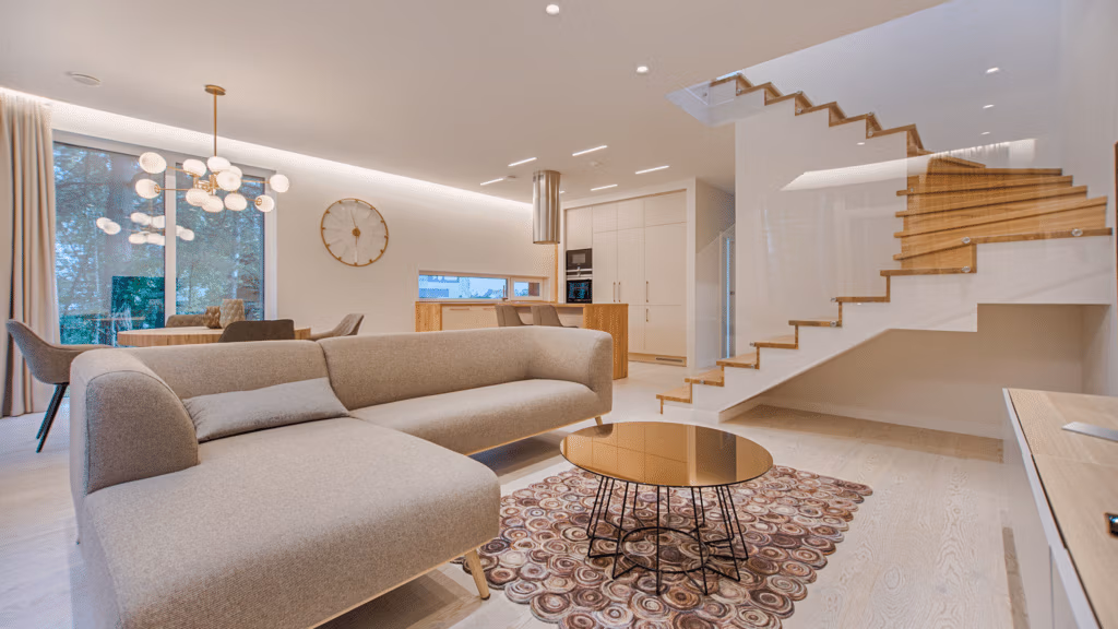 Luxury open-plan residential interior with floating staircase, UK property refurbishment